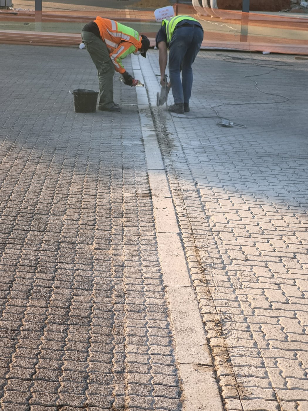 Sputnik Energy technicians cable trenching for an EV charger installation